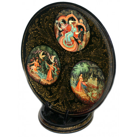 Plate on a stand with an apple